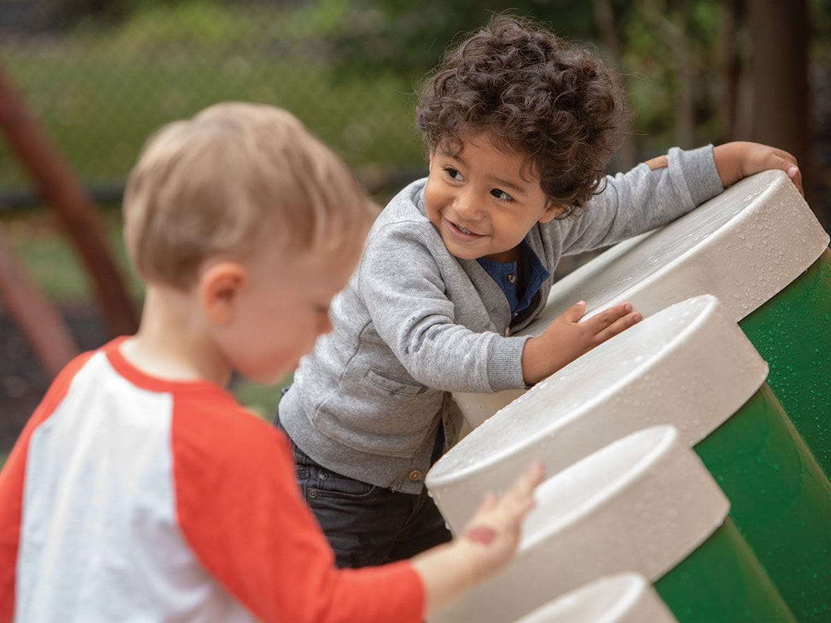 Outdoor playing and learning at Bright Horizons child care